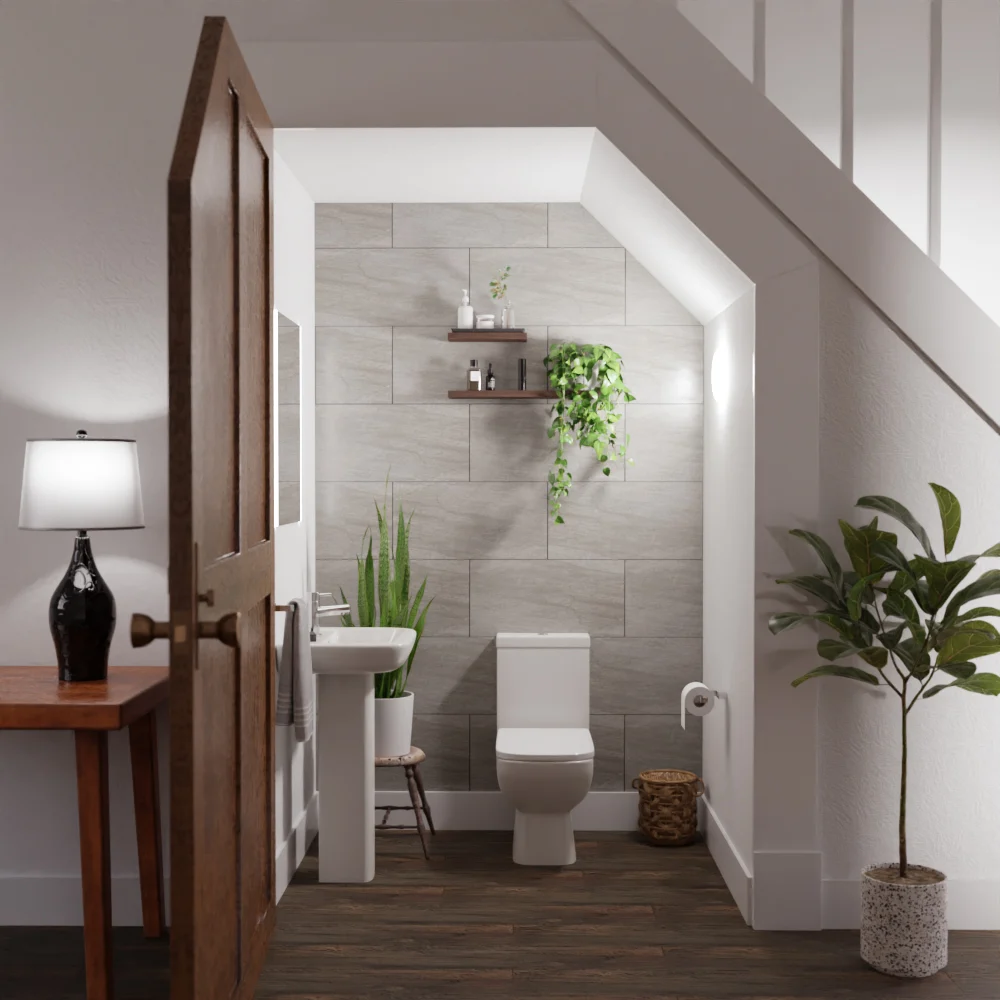 Cloakroom bathroom suite under the stairs with toilet, sink, shelves and greenery.