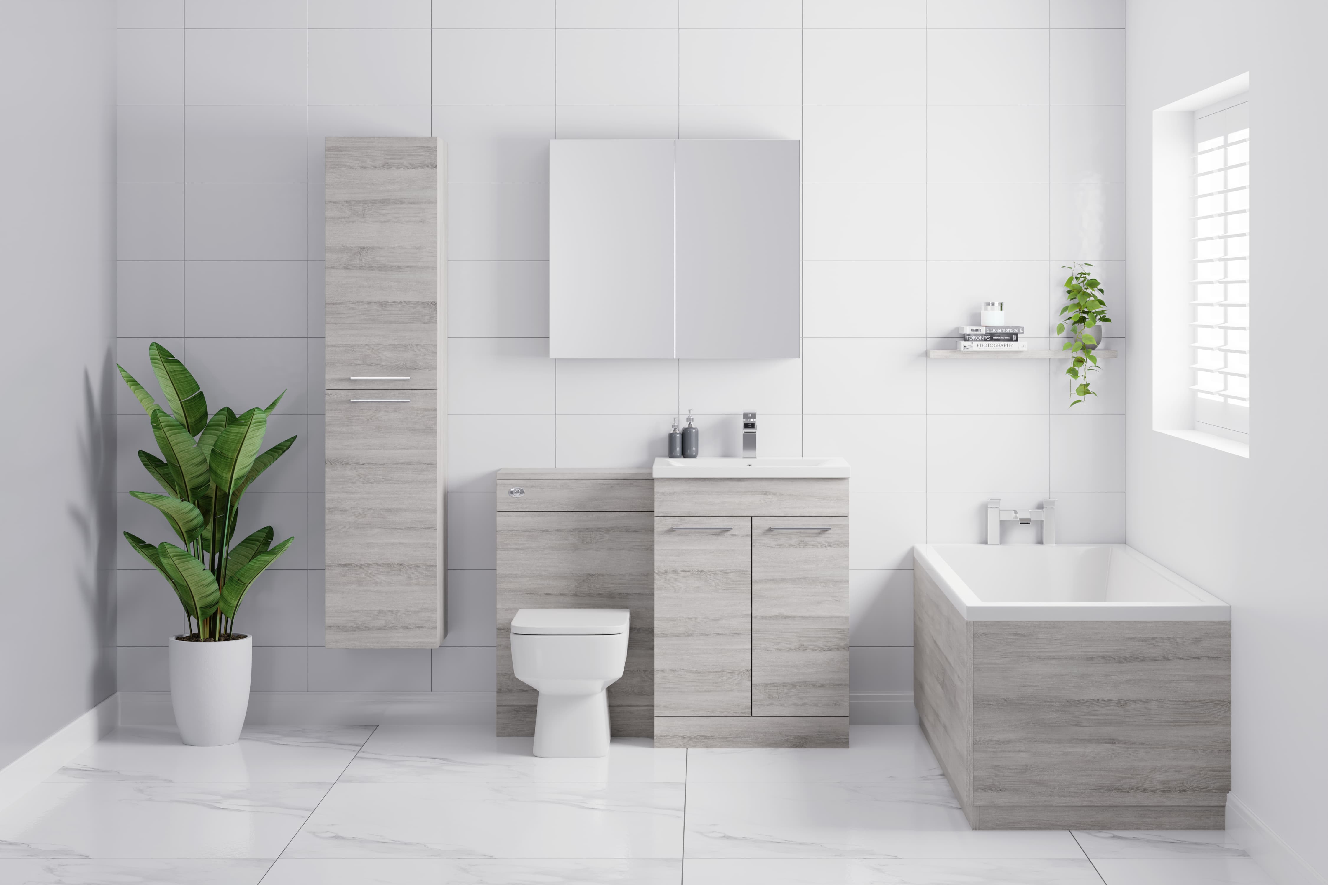 Complete bathroom suite with storage solutions including a vanity unit, mirrored cabinet and tall boy.