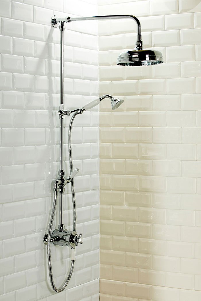 Victorian inspired bathroom- traditional rigid riser shower in white metro tile enclosure