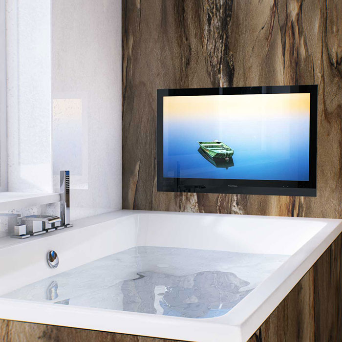 Integrated, waterproof bathroom TV next to a bathtub