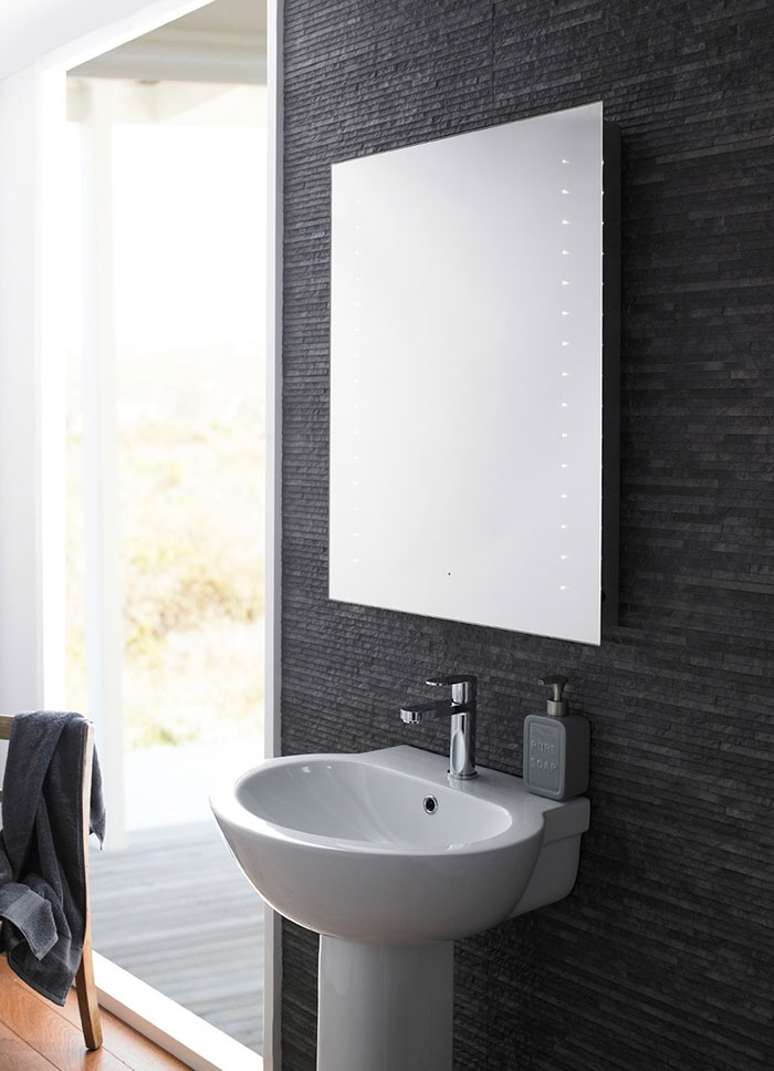 Wall-hung Bluetooth bathroom mirror position above a full pedestal basin