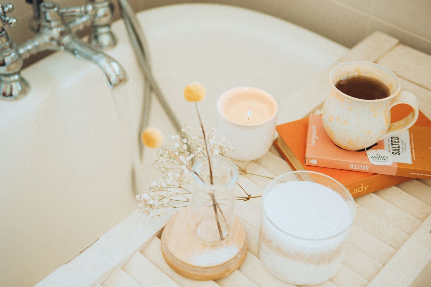 bath tray with candle and book