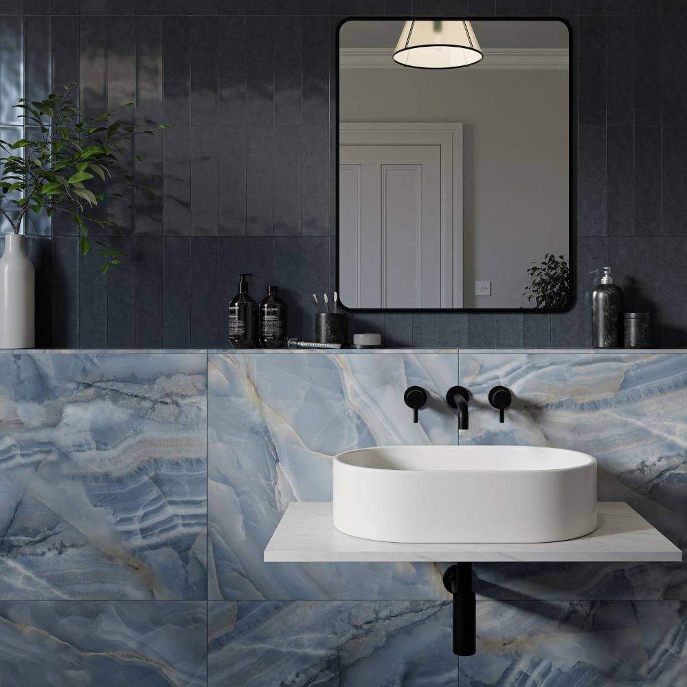 Blue marble and subway style tiles on bathroom wall