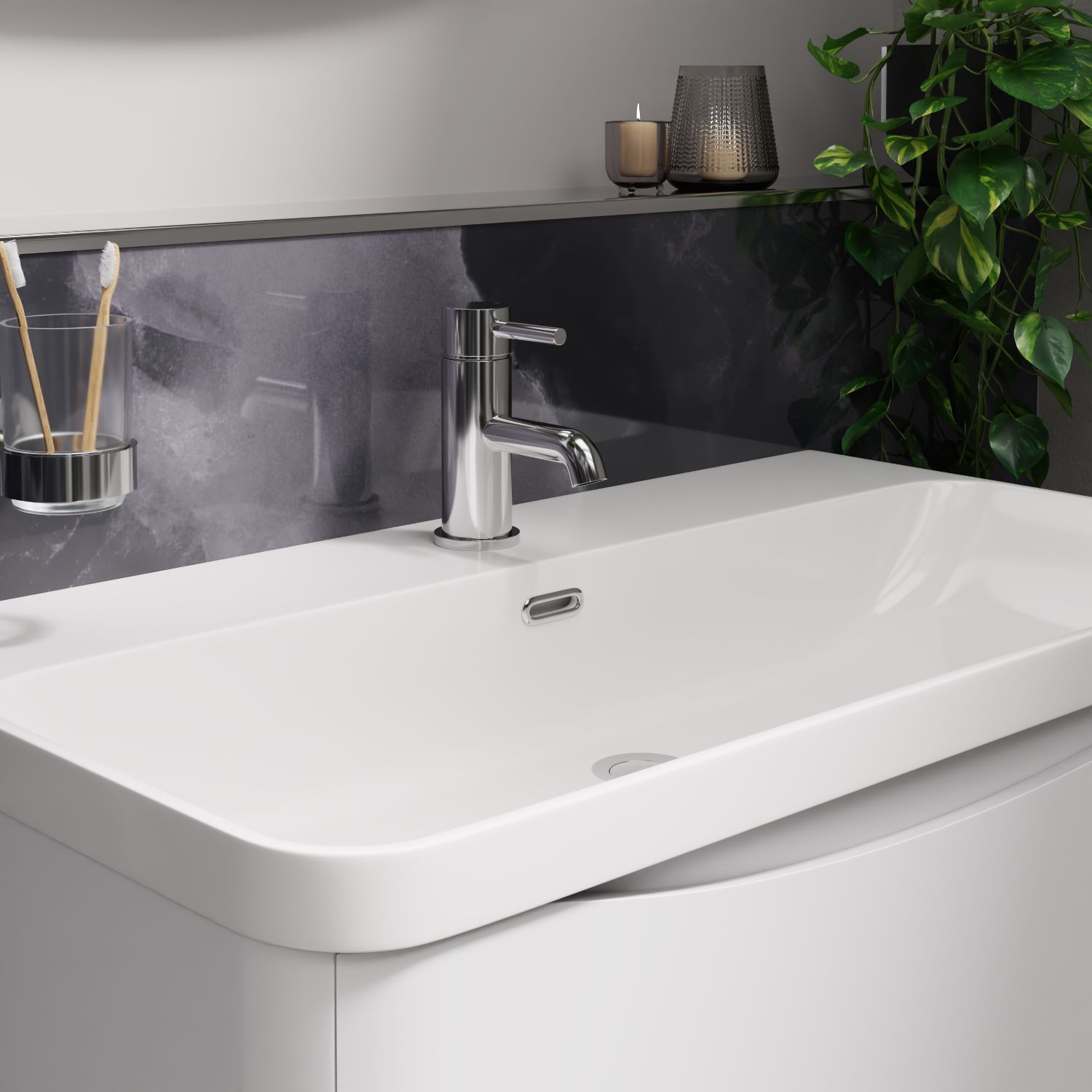 chrome basin tap with dark marble splashback