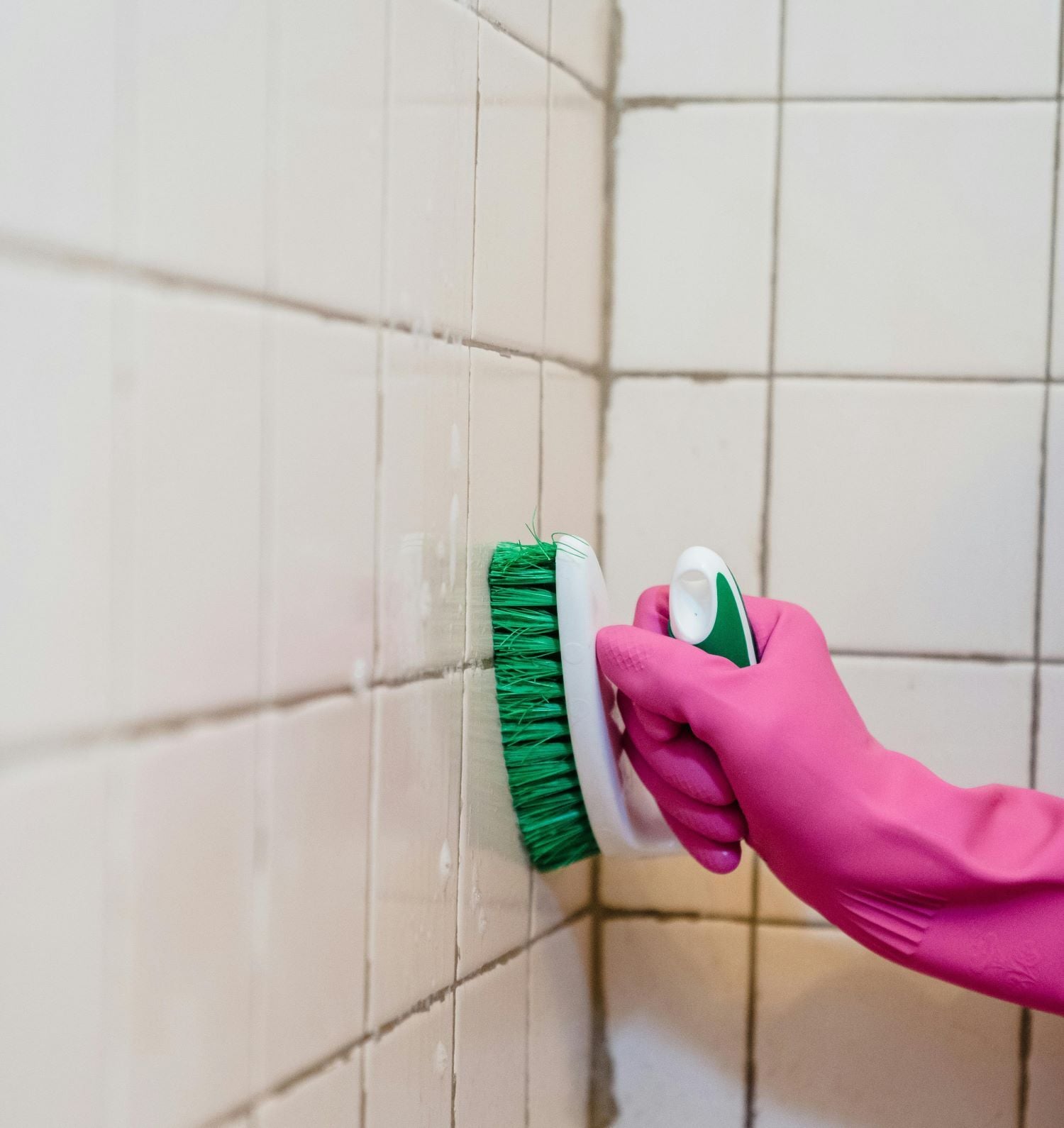 cleaning tile grout with bristle brush
