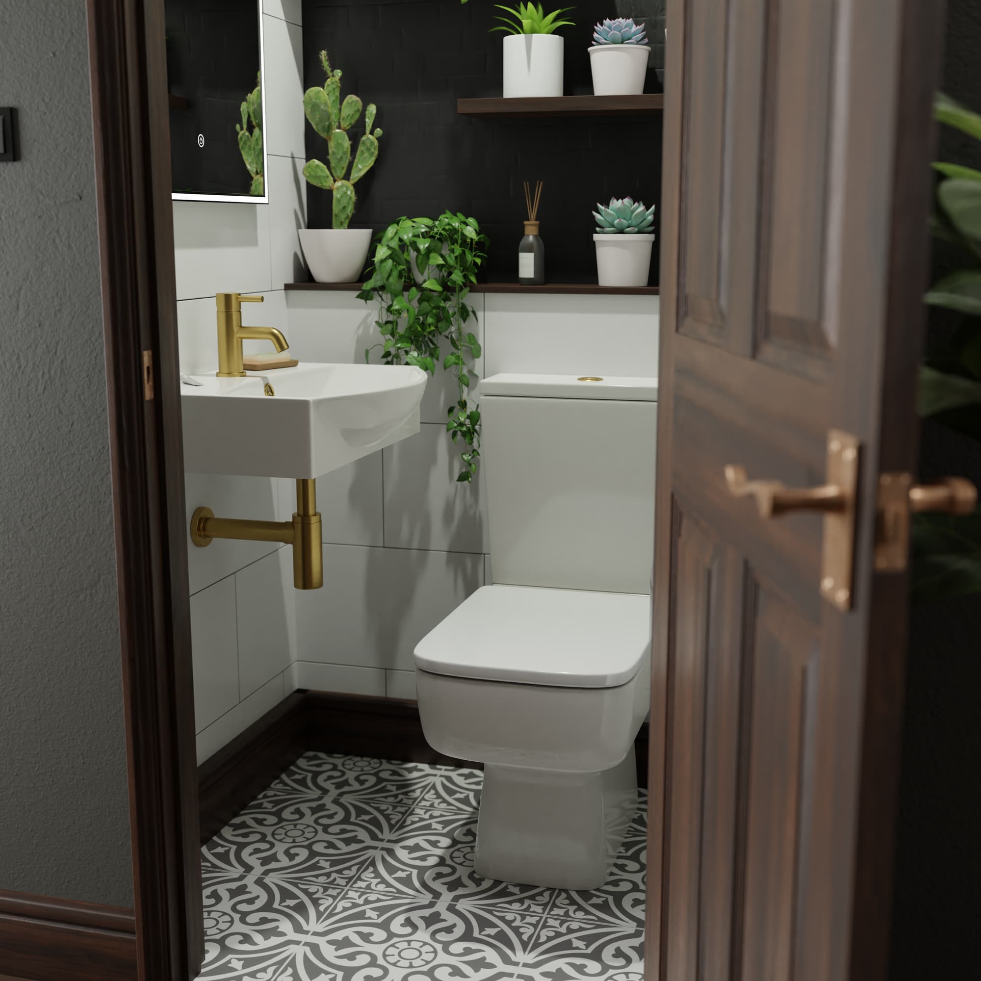 Cloakroom toilet with brass tap, greenery and mosaic tile floor