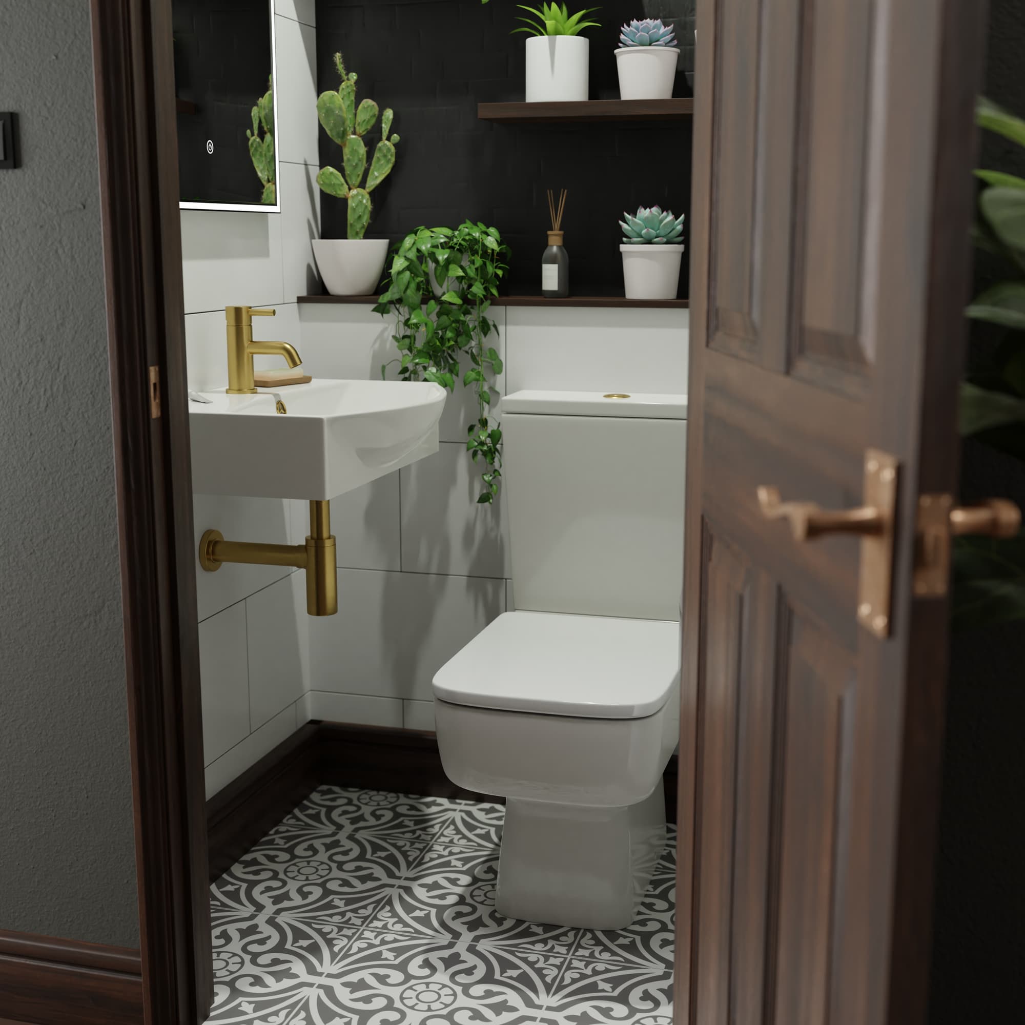 Cloakroom toilet with brass tap, greenery and mosaic tile floor