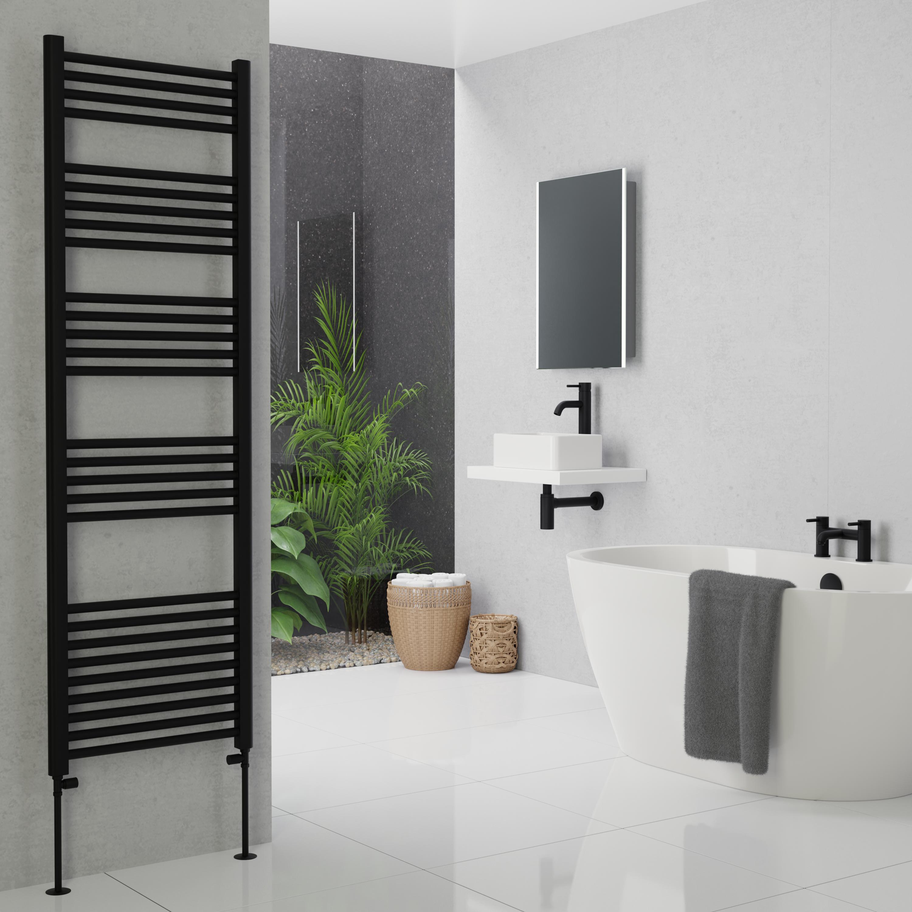 Large black heated towel rail on a bathroom wall