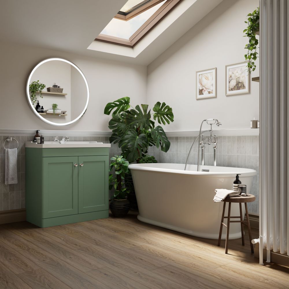 Classic styled bathroom with green vanity and roll top bath