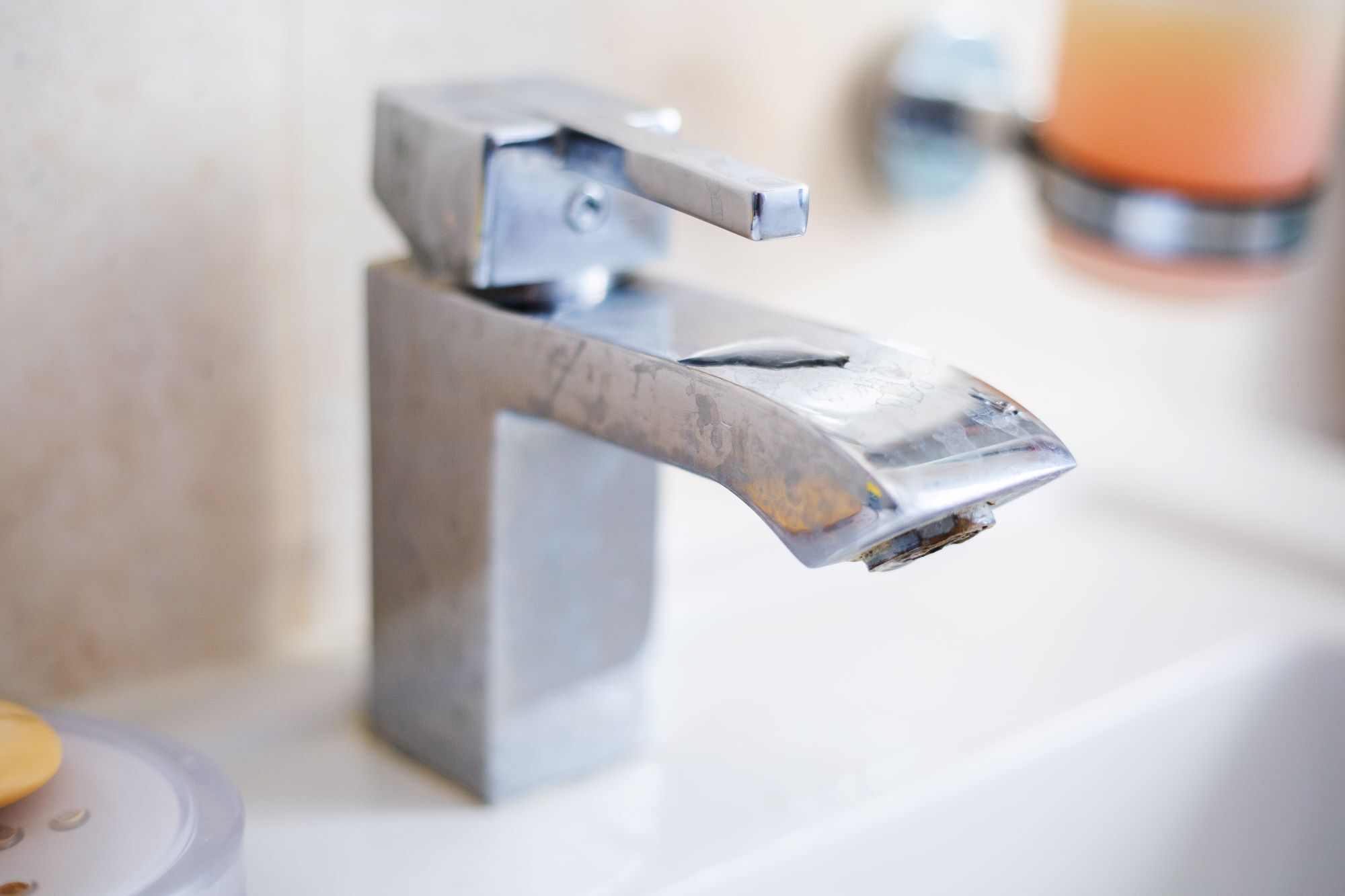 Limescale on a chrome basin tap