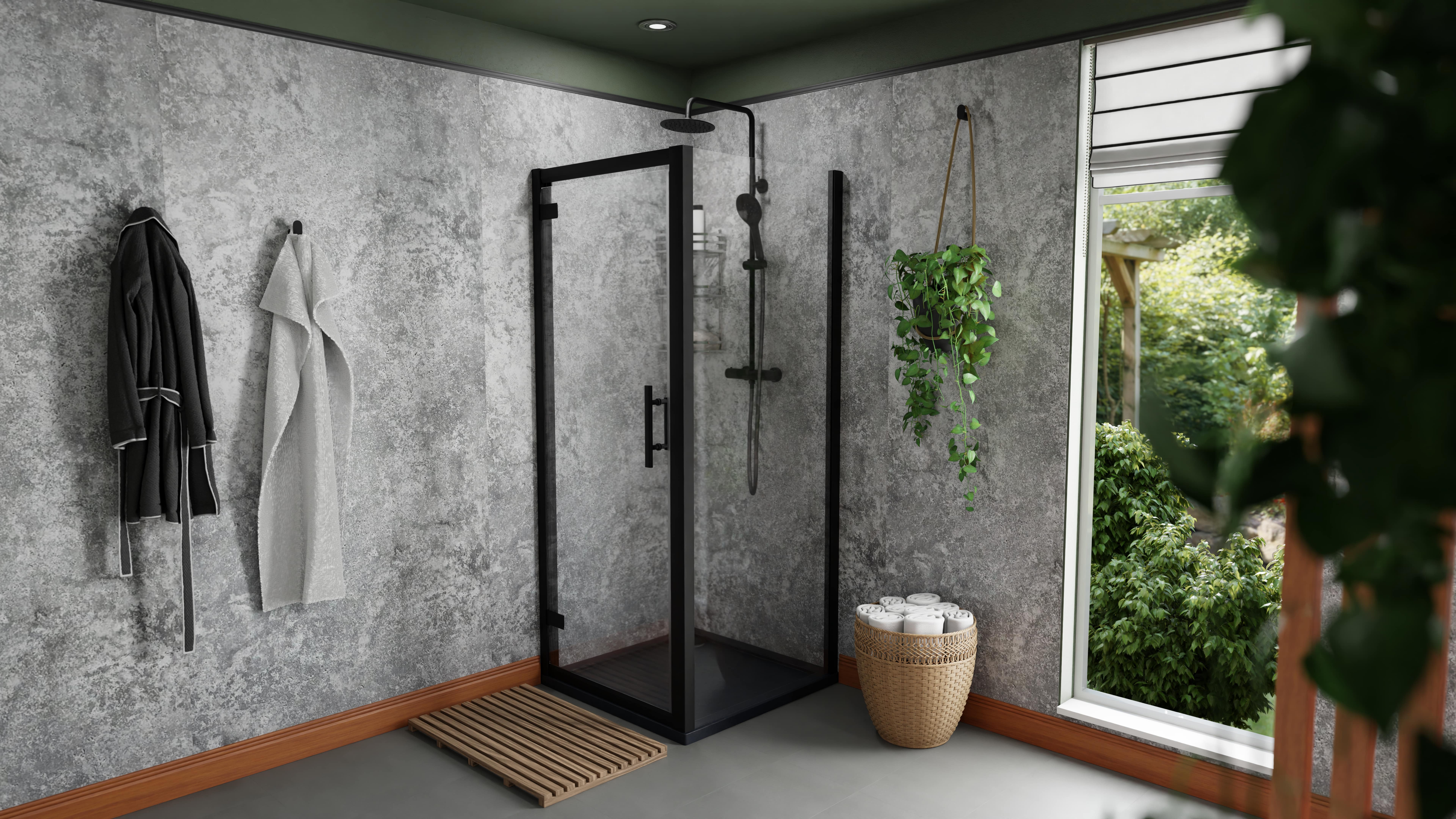 Modern bathroom suite with black framed shower enclosure
