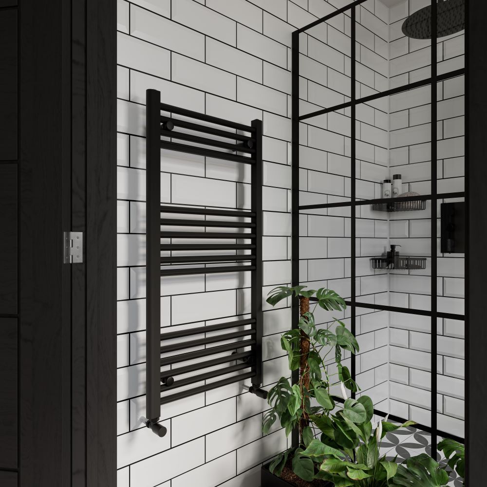 White metro tiles in bathroom against black fittings