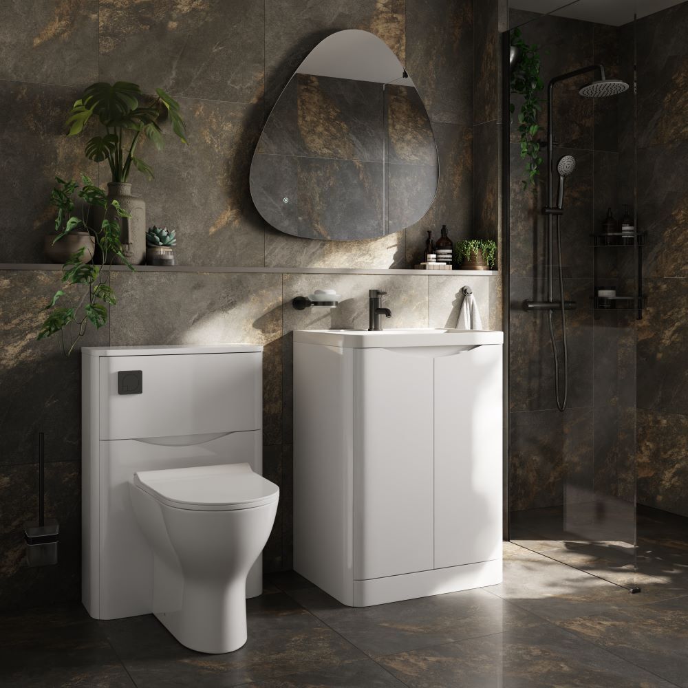 Tile drenched bathroom with dark format tiles