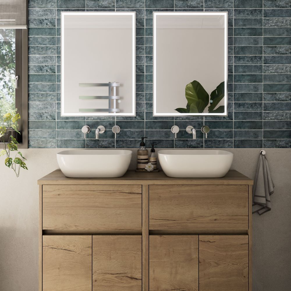 Blue subway tile behind double vanity unit