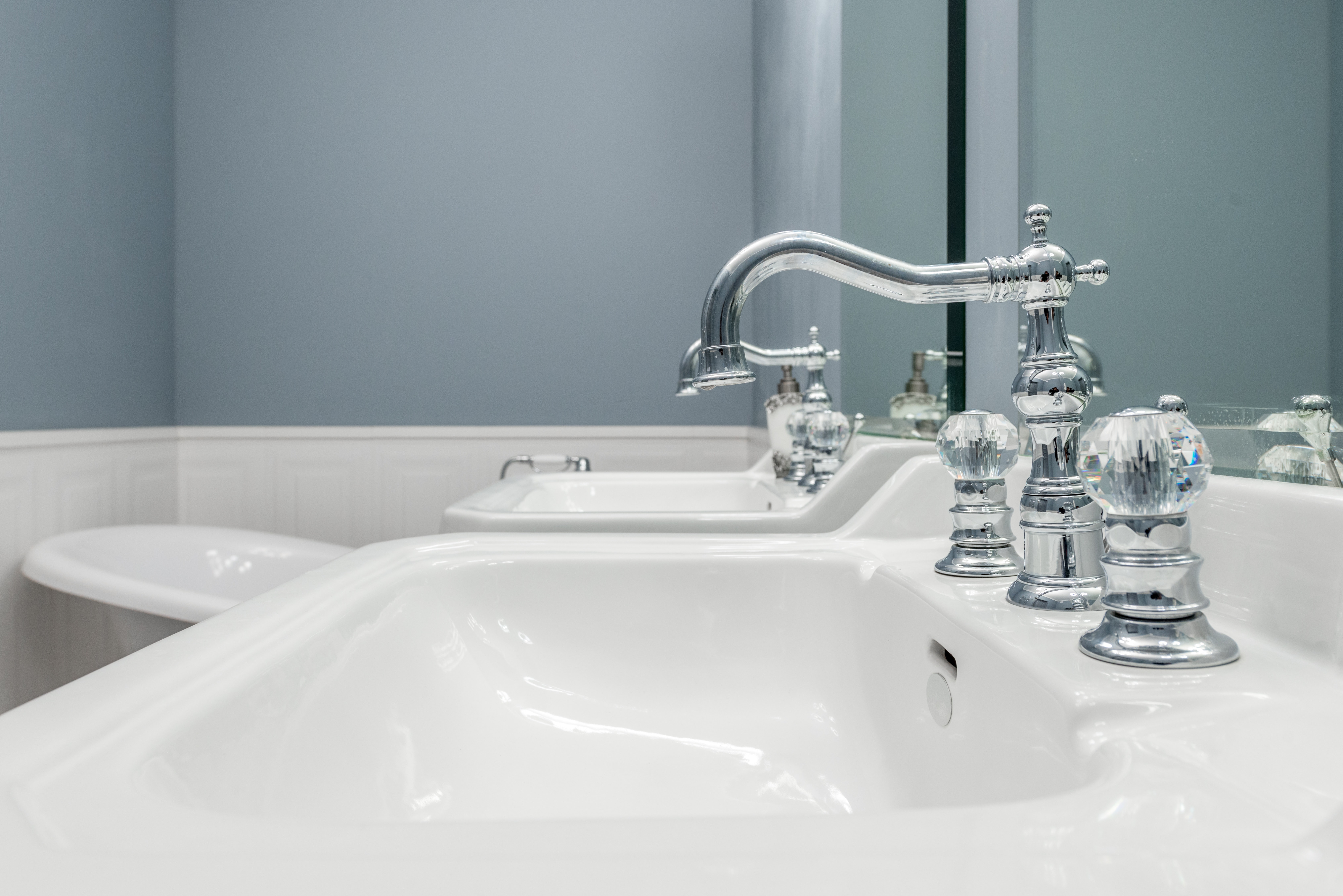 White bathroom basin with stylish traditional taps